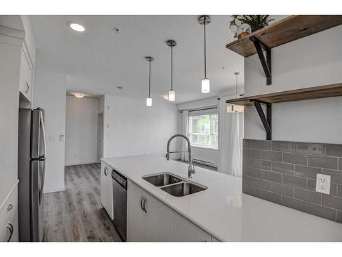 326-20 Seton Park Se, Calgary, AB - Indoor Photo Showing Kitchen With Double Sink With Upgraded Kitchen