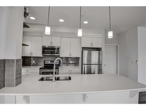 326-20 Seton Park Se, Calgary, AB - Indoor Photo Showing Kitchen With Double Sink With Upgraded Kitchen