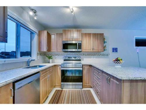 61 Redstone Villas Ne, Calgary, AB - Indoor Photo Showing Kitchen With Stainless Steel Kitchen With Double Sink With Upgraded Kitchen