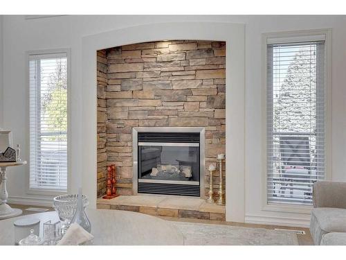 9 Cranwell Place Se, Calgary, AB - Indoor Photo Showing Living Room With Fireplace