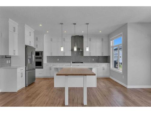 109 Kinniburgh Cove, Chestermere, AB - Indoor Photo Showing Kitchen With Stainless Steel Kitchen With Upgraded Kitchen