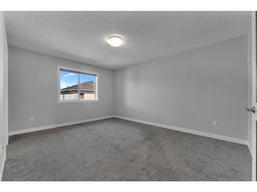 109 Kinniburgh Cove, Chestermere, AB - Indoor Photo Showing Other Room