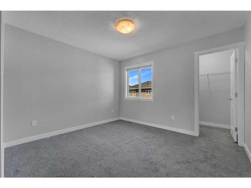 109 Kinniburgh Cove, Chestermere, AB - Indoor Photo Showing Other Room