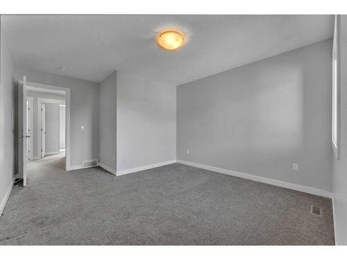 109 Kinniburgh Cove, Chestermere, AB - Indoor Photo Showing Other Room