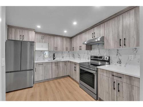 109 Kinniburgh Cove, Chestermere, AB - Indoor Photo Showing Kitchen With Stainless Steel Kitchen