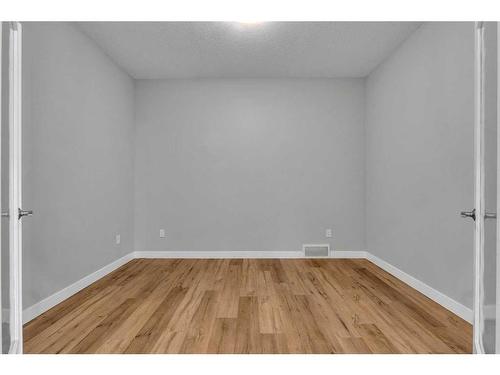 109 Kinniburgh Cove, Chestermere, AB - Indoor Photo Showing Other Room