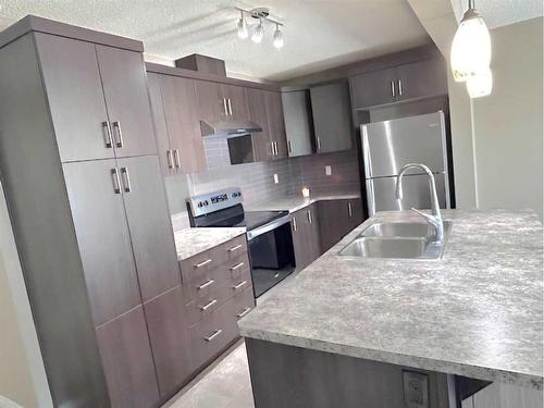 148 Cityscape Row Ne, Calgary, AB - Indoor Photo Showing Kitchen With Stainless Steel Kitchen With Double Sink With Upgraded Kitchen