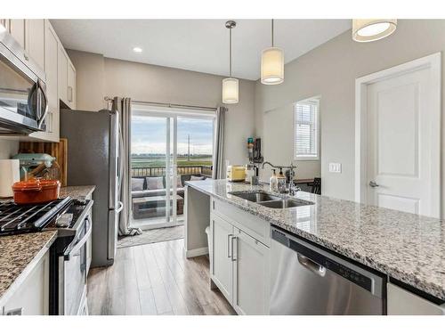 72 Copperstone Common Se, Calgary, AB - Indoor Photo Showing Kitchen With Stainless Steel Kitchen With Double Sink With Upgraded Kitchen