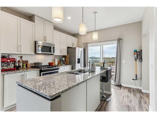 72 Copperstone Common Se, Calgary, AB - Indoor Photo Showing Kitchen With Stainless Steel Kitchen With Double Sink With Upgraded Kitchen