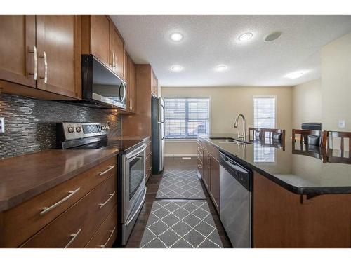 414 Cranford Court Se, Calgary, AB - Indoor Photo Showing Kitchen With Stainless Steel Kitchen With Upgraded Kitchen