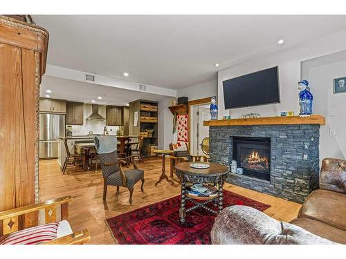 103-707 Spring Creek Drive, Canmore, AB - Indoor Photo Showing Living Room With Fireplace