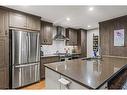 103-707 Spring Creek Drive, Canmore, AB  - Indoor Photo Showing Kitchen With Upgraded Kitchen 