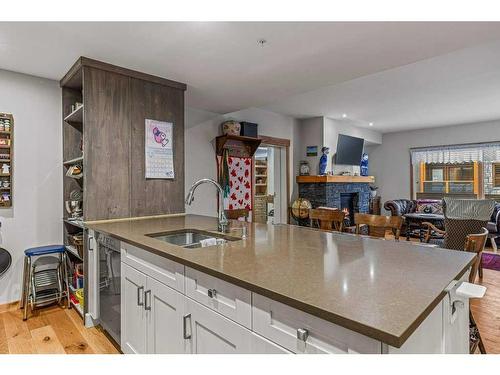 103-707 Spring Creek Drive, Canmore, AB - Indoor Photo Showing Kitchen With Double Sink