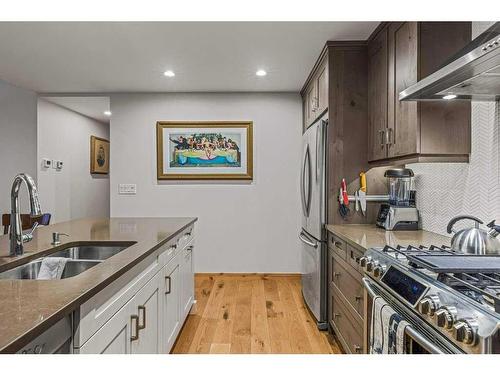 103-707 Spring Creek Drive, Canmore, AB - Indoor Photo Showing Kitchen With Double Sink