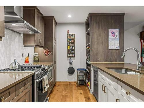 103-707 Spring Creek Drive, Canmore, AB - Indoor Photo Showing Kitchen With Double Sink