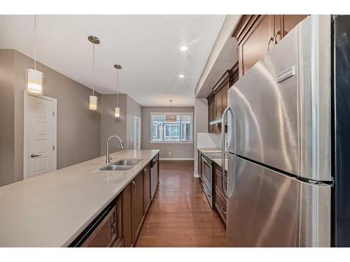 223 Panatella Walk Nw, Calgary, AB - Indoor Photo Showing Kitchen With Stainless Steel Kitchen With Double Sink With Upgraded Kitchen