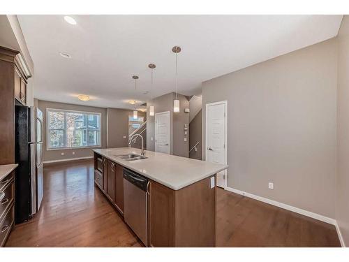 223 Panatella Walk Nw, Calgary, AB - Indoor Photo Showing Kitchen With Double Sink