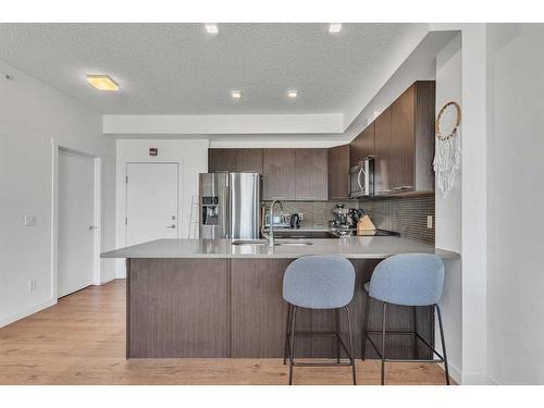 403-214 Sherwood Square Nw, Calgary, AB - Indoor Photo Showing Kitchen With Stainless Steel Kitchen