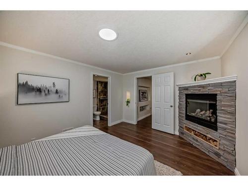 52 Riverbirch Road Se, Calgary, AB - Indoor Photo Showing Other Room With Fireplace