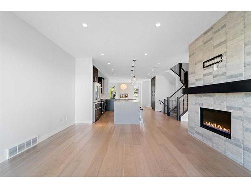 5604 37 Street Sw, Calgary, AB - Indoor Photo Showing Living Room With Fireplace