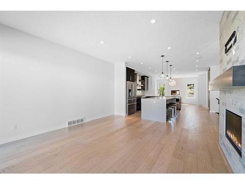 5604 37 Street Sw, Calgary, AB - Indoor Photo Showing Living Room With Fireplace