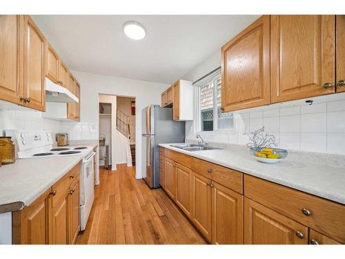 7629 24A Street Se, Calgary, AB - Indoor Photo Showing Kitchen With Double Sink