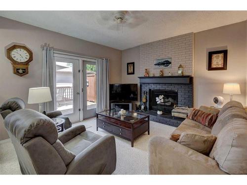 151 Deer Park Place Se, Calgary, AB - Indoor Photo Showing Living Room With Fireplace