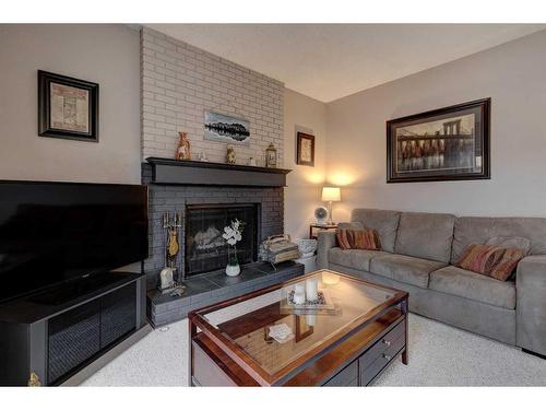 151 Deer Park Place Se, Calgary, AB - Indoor Photo Showing Living Room With Fireplace