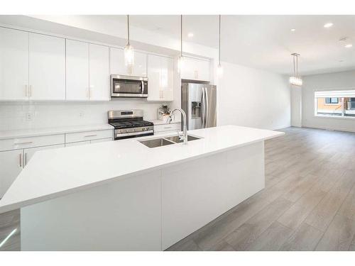 340 Sage Hill Circle Nw, Calgary, AB - Indoor Photo Showing Kitchen With Stainless Steel Kitchen With Double Sink With Upgraded Kitchen