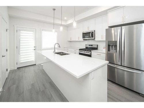 340 Sage Hill Circle Nw, Calgary, AB - Indoor Photo Showing Kitchen With Stainless Steel Kitchen With Double Sink With Upgraded Kitchen