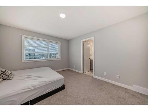 63 Wolf Creek Avenue Se, Calgary, AB - Indoor Photo Showing Bedroom