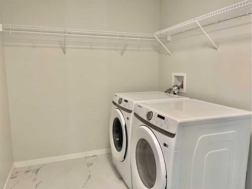 406-40 Carrington Plaza Nw, Calgary, AB - Indoor Photo Showing Laundry Room