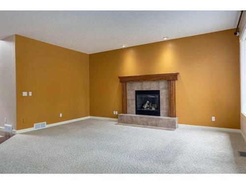 47 Discovery Ridge Circle Sw, Calgary, AB - Indoor Photo Showing Living Room With Fireplace