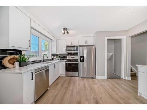 352 Queensland Drive Se, Calgary, AB - Indoor Photo Showing Kitchen With Stainless Steel Kitchen