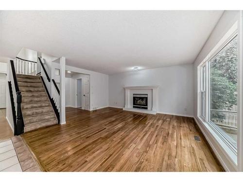 107 Douglasview Bay Se, Calgary, AB - Indoor Photo Showing Living Room With Fireplace