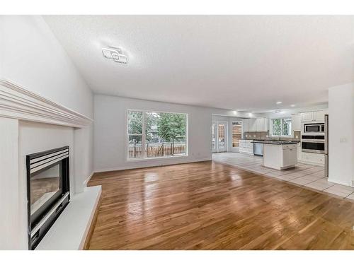 107 Douglasview Bay Se, Calgary, AB - Indoor Photo Showing Living Room With Fireplace