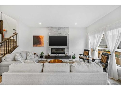 322 Edith Road Nw, Calgary, AB - Indoor Photo Showing Living Room With Fireplace