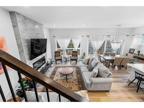 322 Edith Road Nw, Calgary, AB - Indoor Photo Showing Living Room With Fireplace