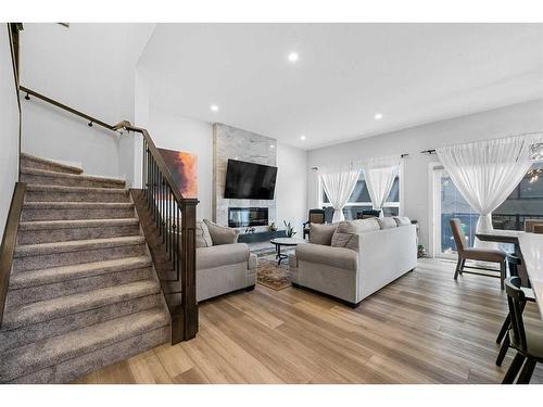 322 Edith Road Nw, Calgary, AB - Indoor Photo Showing Living Room With Fireplace