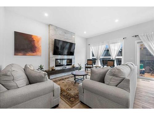 322 Edith Road Nw, Calgary, AB - Indoor Photo Showing Living Room With Fireplace