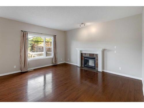 306 Rockyspring Circle Nw, Calgary, AB - Indoor Photo Showing Living Room With Fireplace