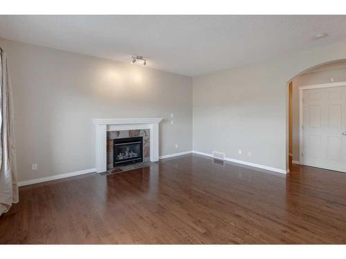 306 Rockyspring Circle Nw, Calgary, AB - Indoor Photo Showing Living Room With Fireplace