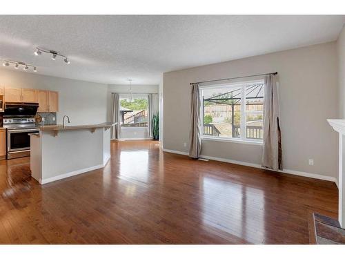 306 Rockyspring Circle Nw, Calgary, AB - Indoor Photo Showing Kitchen With Fireplace