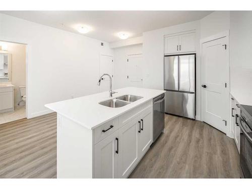 1305-55 Lucas Way Nw, Calgary, AB - Indoor Photo Showing Kitchen With Stainless Steel Kitchen With Double Sink