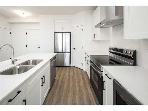 1305-55 Lucas Way Nw, Calgary, AB - Indoor Photo Showing Kitchen With Stainless Steel Kitchen With Double Sink With Upgraded Kitchen