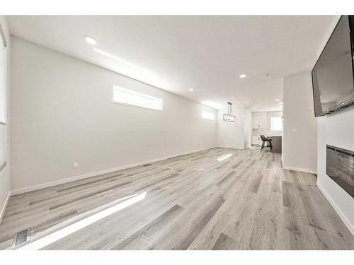 93 Setonstone Green Se, Calgary, AB - Indoor With Fireplace