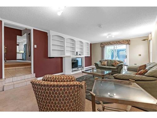 13907 Deer Ridge Drive Se, Calgary, AB - Indoor Photo Showing Living Room With Fireplace