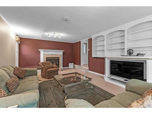 13907 Deer Ridge Drive Se, Calgary, AB - Indoor Photo Showing Living Room With Fireplace