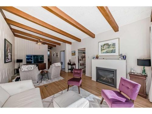 1336 / 1338 Rosehill Drive Nw, Calgary, AB - Indoor Photo Showing Living Room With Fireplace