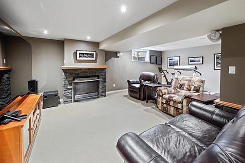 4012 Chatham Place Nw, Calgary, AB - Indoor Photo Showing Basement With Fireplace